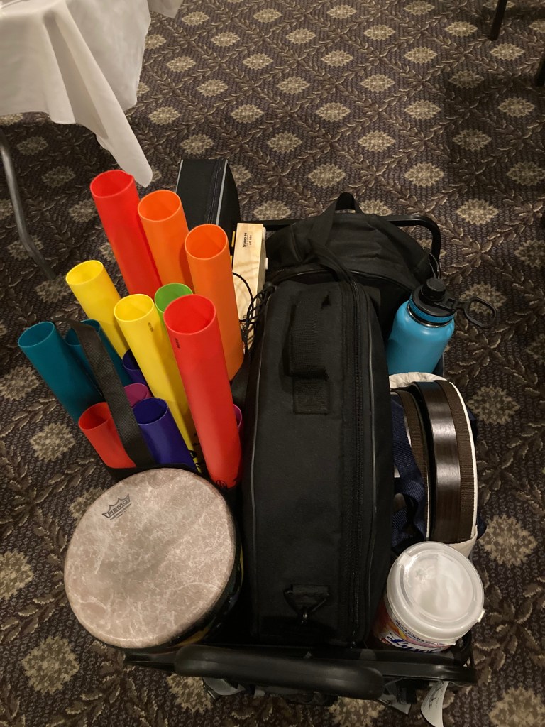 Portable cart filled with various hand-percussion instruments and music therapy equipment
